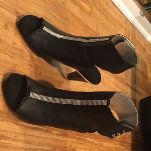 Black heels with gems going down the middle